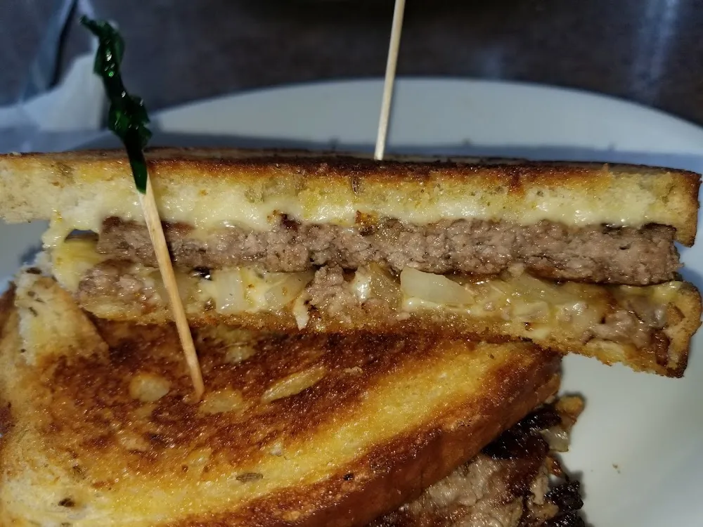 Patti Melt with Swiss Cheese Grilled Onions on Rye All Burgers Cooked to Order